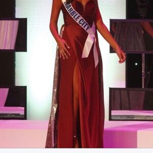 Custom LaFemme maroon dress with silver train